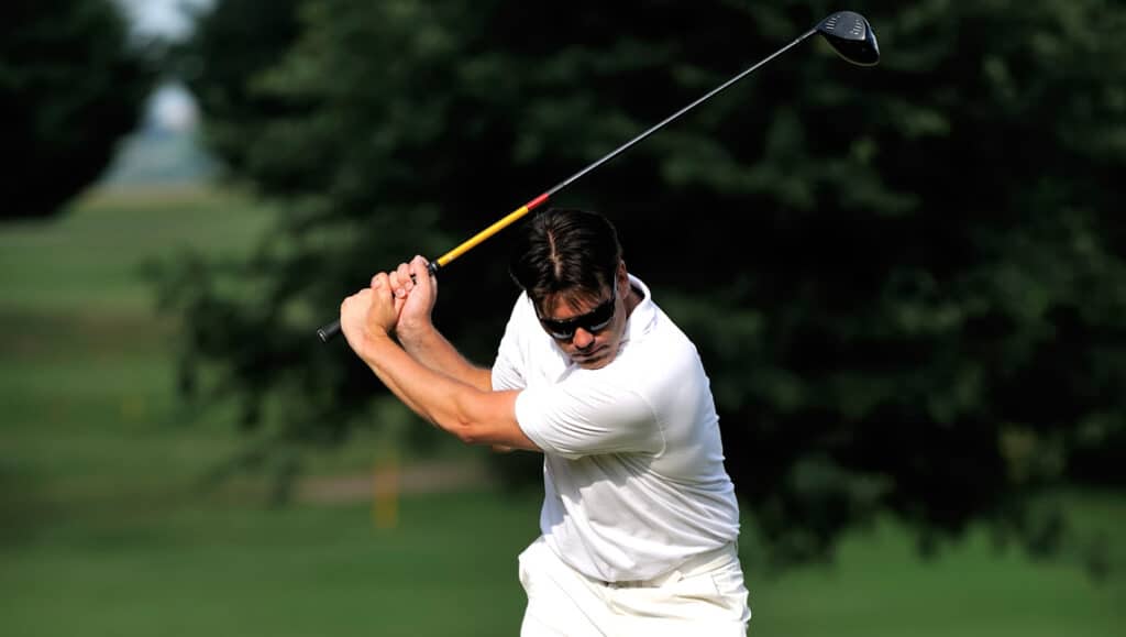 Person golfing