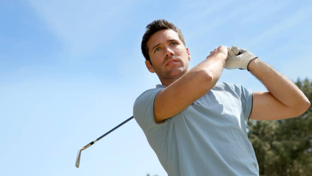 Person golfing
