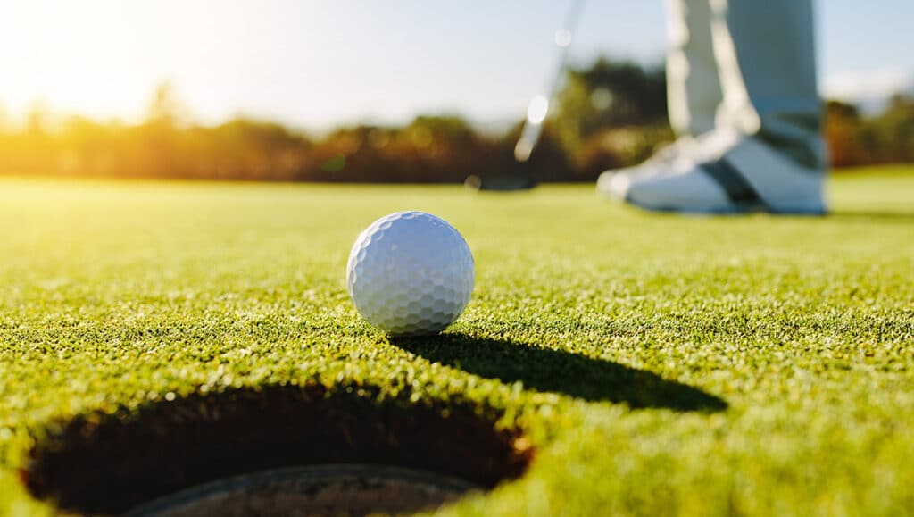 Golf ball and hole