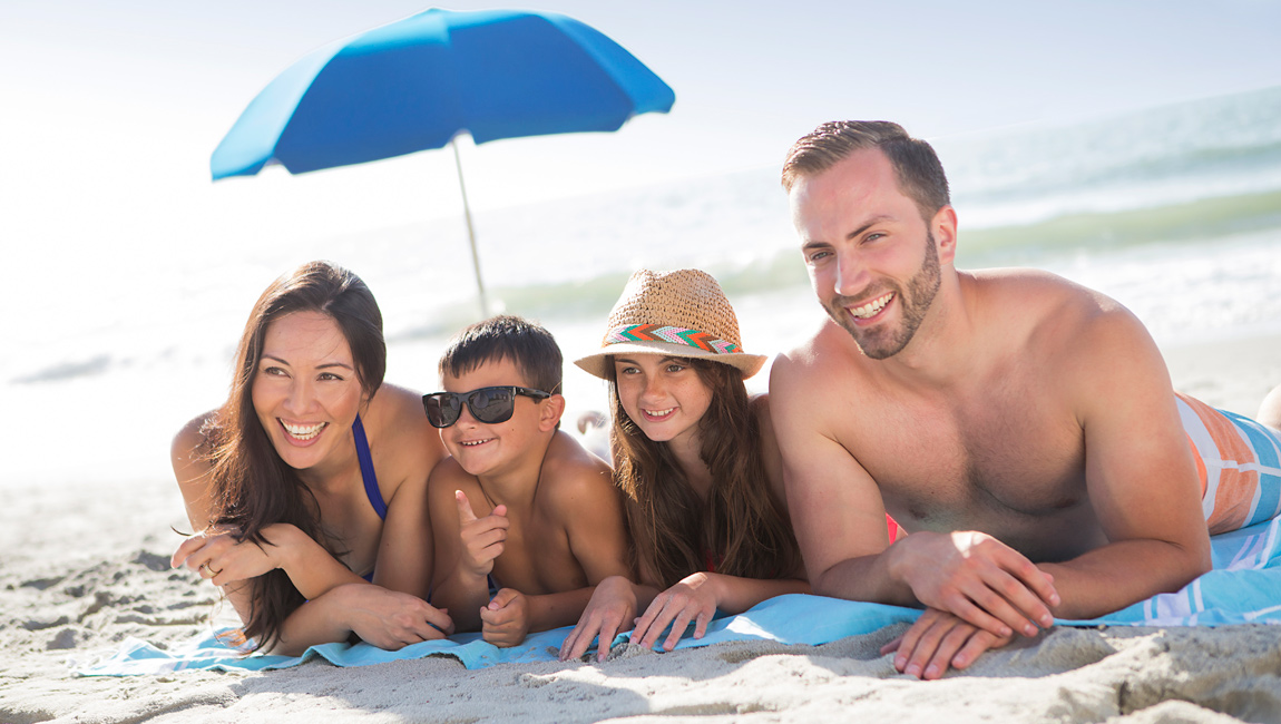 Family under an umbrella in Myrtle Beach